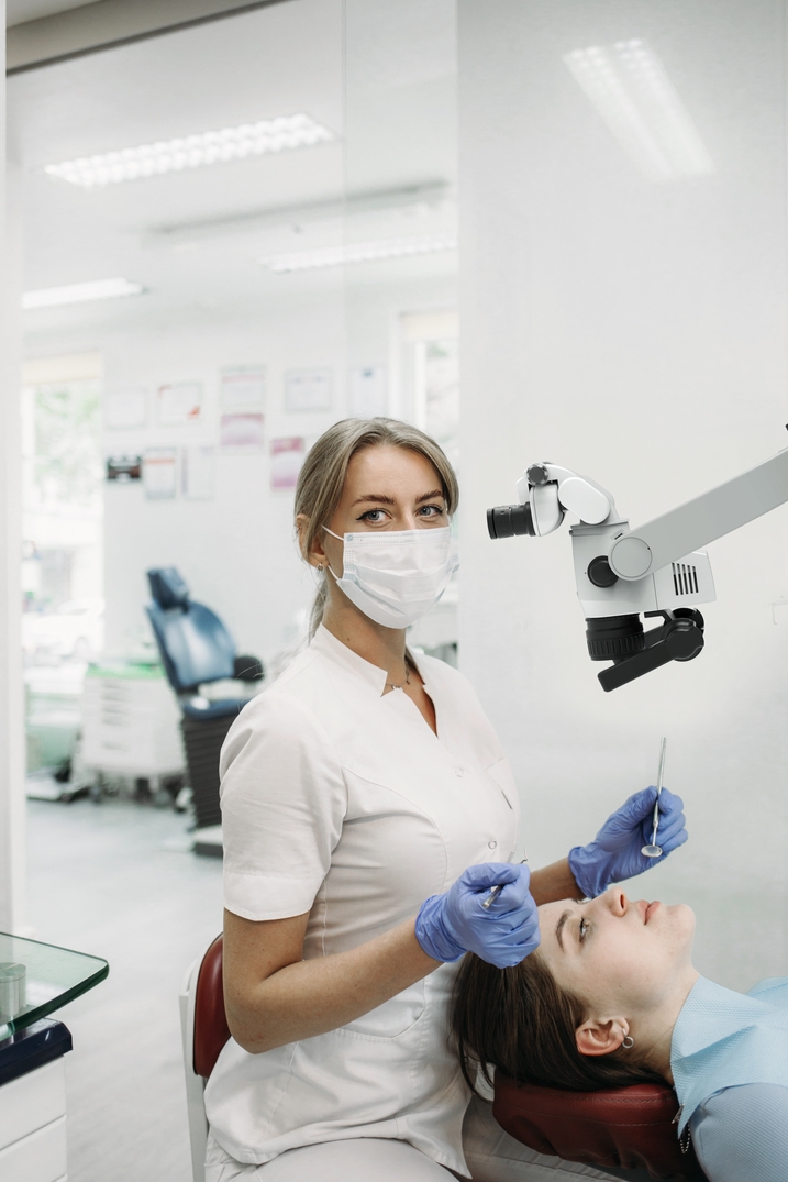 professional dentist examination patient with microscope at the office. professional dentist examination patient with microscope at the office.
