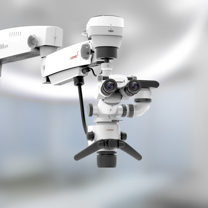 Empty table in operating room with lighting lamp. The interior of the clinic. Without people Empty,Table,In,Operating,Room,With,Lighting,Lamp.,The,Interior